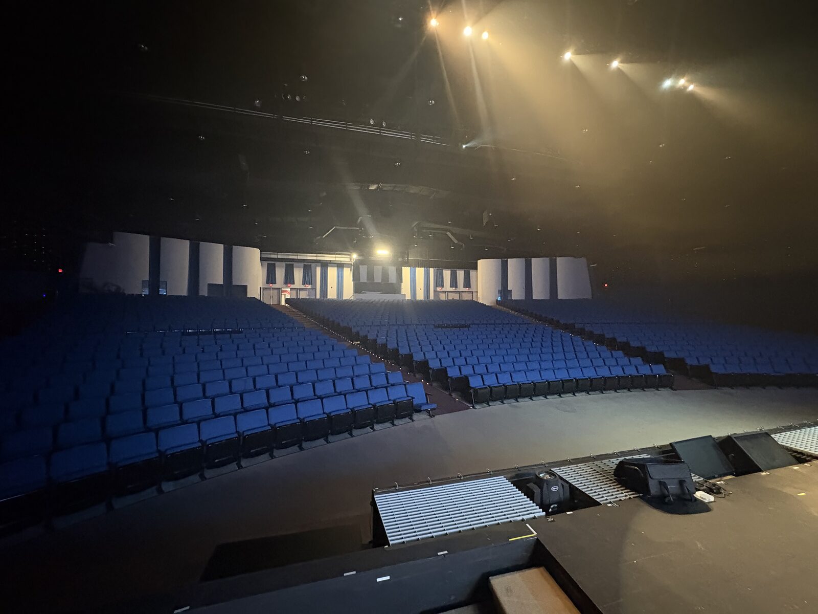 The Freedom Encounter Theater auditorium seating under stage lighting